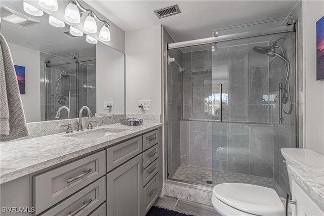 7430 Lake Breeze Dr Unit 403, Fort Myers, FL 33907 - bathroom with vanity, toilet, a shower stall, and tile patterned floors