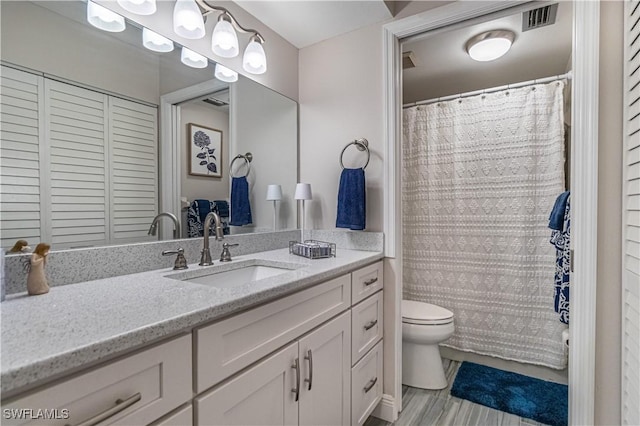 7430 Lake Breeze Dr Unit 403, Fort Myers, FL 33907 - bathroom featuring toilet, vanity, and a shower with shower curtain