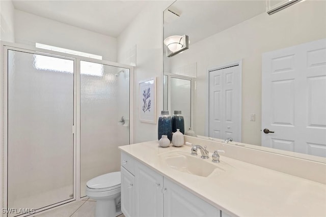 173 Gulfport Ct, Marco Island, FL 34145 - full bathroom with vanity, toilet, a stall shower, and tile patterned floors
