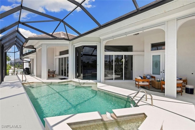 173 Gulfport Ct, Marco Island, FL 34145 - view of swimming pool with a patio, glass enclosure, a pool with connected hot tub, and outdoor lounge area