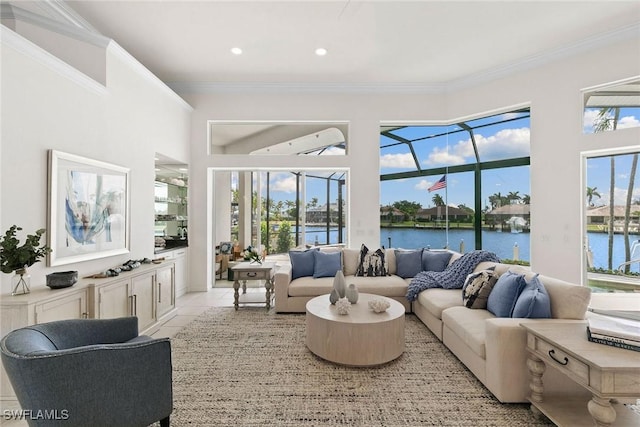 173 Gulfport Ct, Marco Island, FL 34145 - living area with a water view, crown molding, a sunroom, light tile patterned floors, and recessed lighting