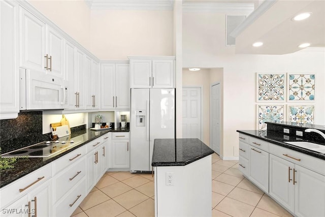 173 Gulfport Ct, Marco Island, FL 34145 - kitchen with white appliances, a sink, white cabinetry, crown molding, and light tile patterned floors