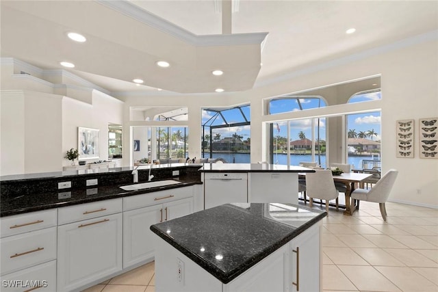 173 Gulfport Ct, Marco Island, FL 34145 - kitchen with a sink, dishwasher, ornamental molding, light tile patterned floors, and a water view