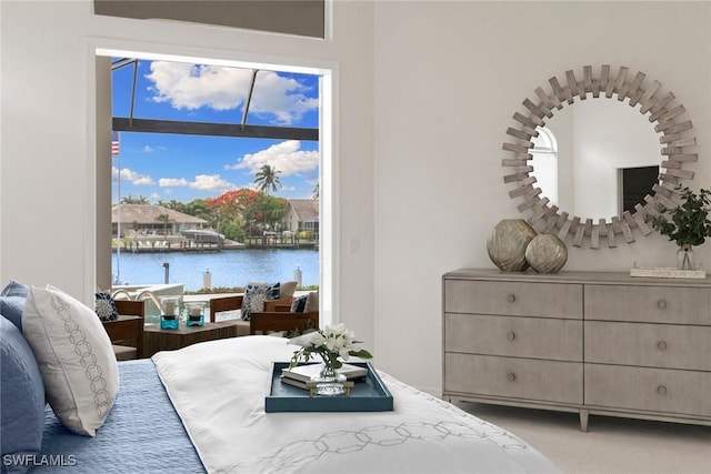 173 Gulfport Ct, Marco Island, FL 34145 - carpeted bedroom with a water view and access to exterior