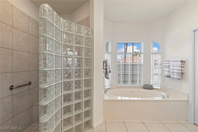 173 Gulfport Ct, Marco Island, FL 34145 - bathroom with a garden tub, a walk in shower, and tile patterned flooring