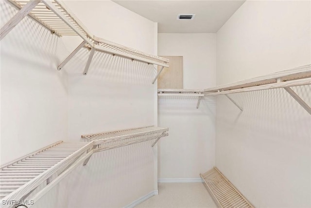 173 Gulfport Ct, Marco Island, FL 34145 - walk in closet with light colored carpet