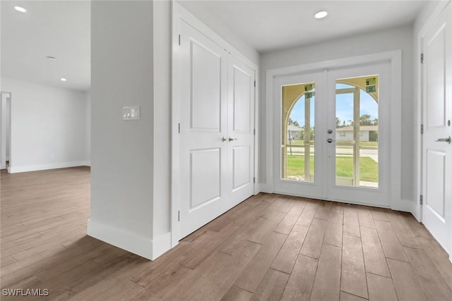 3739 Palm Tree Blvd, Cape Coral, FL 33904 - entryway featuring french doors, light wood-style flooring, baseboards, and recessed lighting