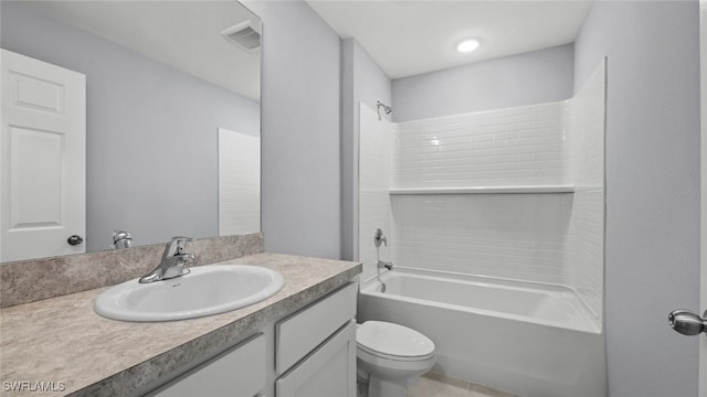 2511 50th St W, Lehigh Acres, FL 33971 - bathroom featuring vanity, toilet,  shower combination, and tile patterned floors