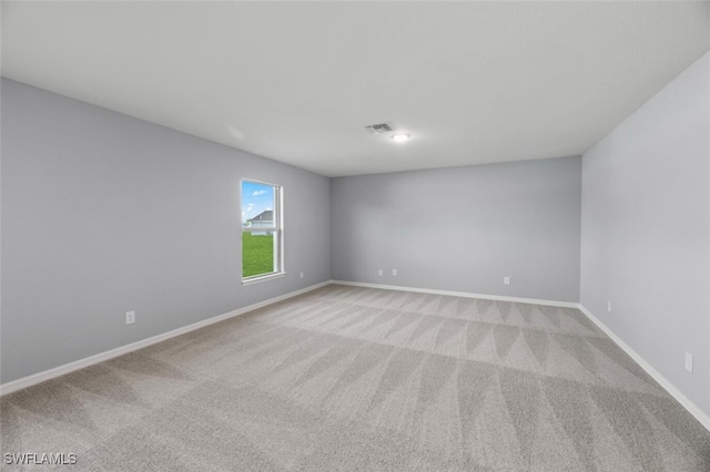 2511 50th St W, Lehigh Acres, FL 33971 - unfurnished room featuring light carpet and baseboards
