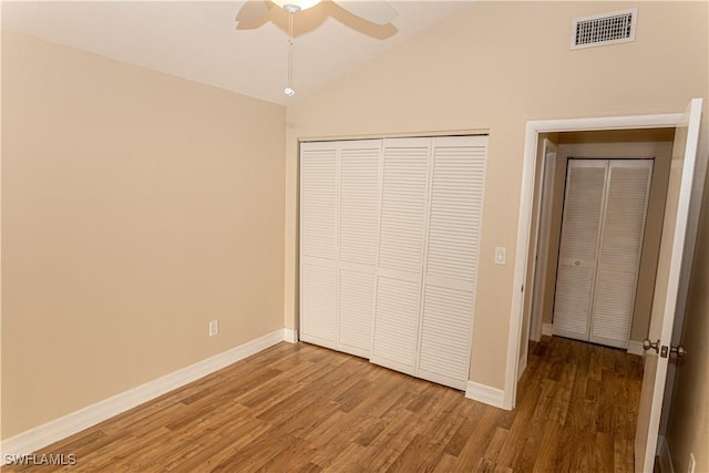 13391 Broadhurst Loop, Fort Myers, FL 33919 - unfurnished bedroom featuring wood finished floors, baseboards, a closet, vaulted ceiling, and a ceiling fan