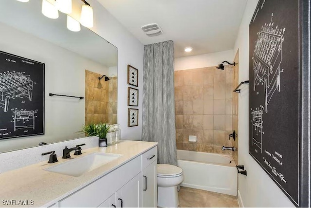16935 Sage Ter, Punta Gorda, FL 33982 - bathroom featuring vanity, tile patterned floors, toilet, and shower / bath combo with shower curtain