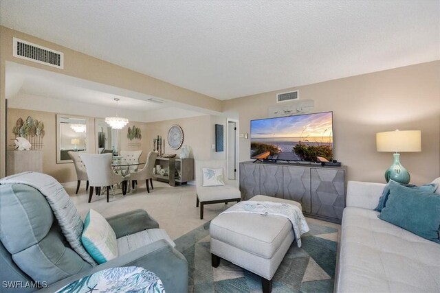 3200 Gulf Shore Blvd N Unit 403, Naples, FL 34103 - living room with a chandelier