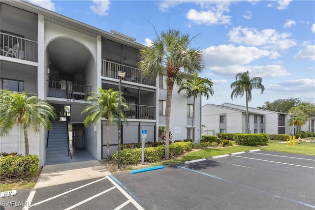9970 Sailview Ct Unit 20, Fort Myers, FL 33905 - view of property with uncovered parking and stairway