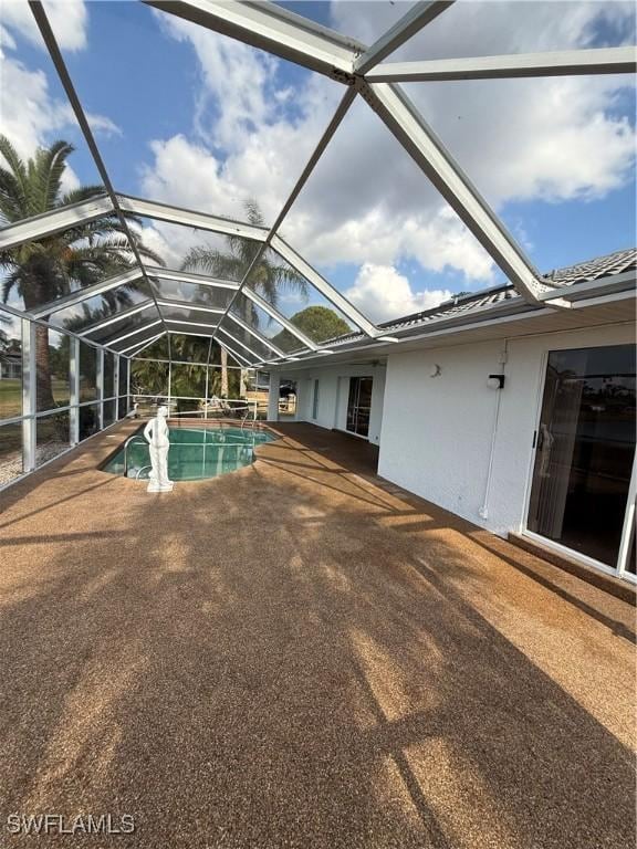 2803 E 5th St, Lehigh Acres, FL 33972 - swimming pool featuring a patio and glass enclosure