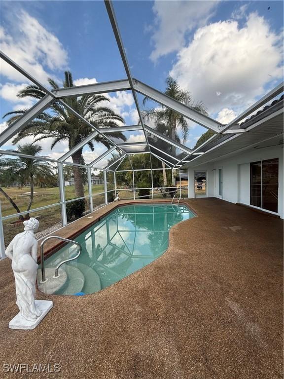 2803 E 5th St, Lehigh Acres, FL 33972 - swimming pool with a patio and a lanai