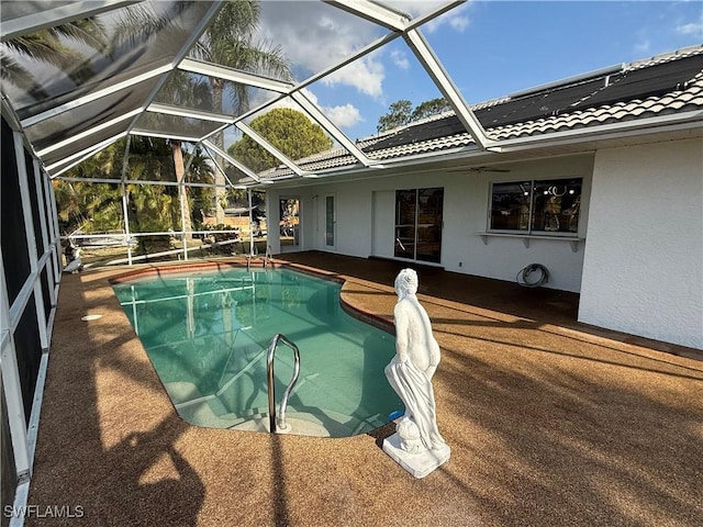 2803 E 5th St, Lehigh Acres, FL 33972 - swimming pool featuring a patio area, a ceiling fan, and glass enclosure