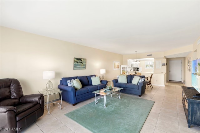 860 Panama Ct Unit 107, Marco Island, FL 34145 - living area with light tile patterned flooring and a chandelier