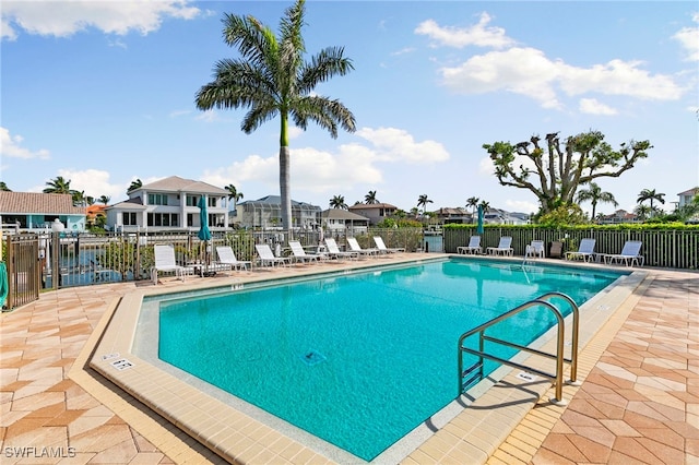 860 Panama Ct Unit 107, Marco Island, FL 34145 - community pool featuring a patio area and a residential view