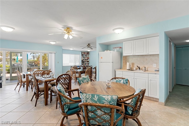 860 Panama Ct Unit 107, Marco Island, FL 34145 - dining room with light tile patterned floors and ceiling fan