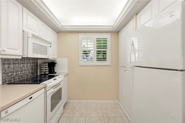 860 Panama Ct Unit 107, Marco Island, FL 34145 - kitchen featuring white appliances, white cabinets, light tile patterned flooring, baseboards, and decorative backsplash