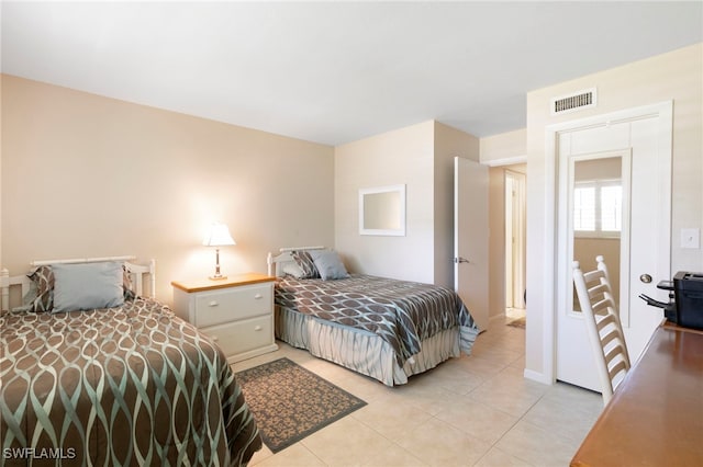 860 Panama Ct Unit 107, Marco Island, FL 34145 - bedroom with light tile patterned flooring