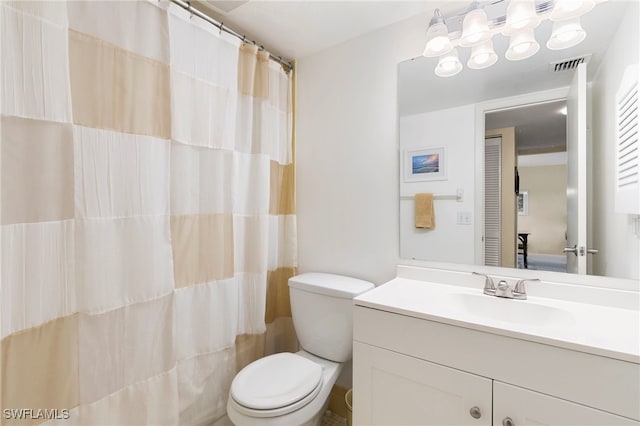 860 Panama Ct Unit 107, Marco Island, FL 34145 - bathroom featuring vanity, toilet, and a shower with curtain