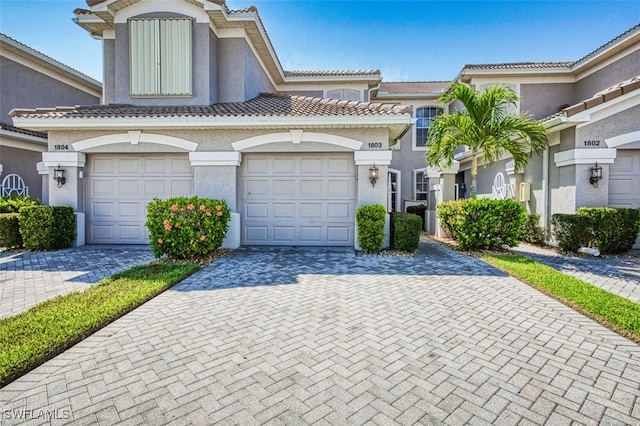 10011 Sky View Way Unit 1803, Fort Myers, FL 33913 - view of front of house with decorative driveway, stucco siding, and a tile roof