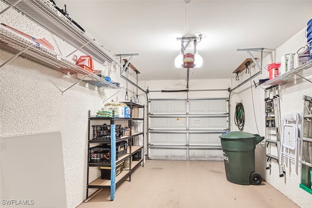 10011 Sky View Way Unit 1803, Fort Myers, FL 33913 - garage with a garage door opener and a textured wall