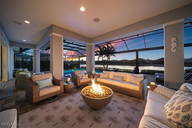 14372 Neptune Ave, Naples, FL 34114 - view of patio with an outdoor living space with a fire pit, an outdoor pool, glass enclosure, and a water view