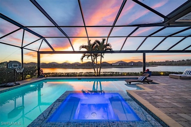 14372 Neptune Ave, Naples, FL 34114 - pool at dusk featuring a patio, a pool with connected hot tub, a lanai, and a water view