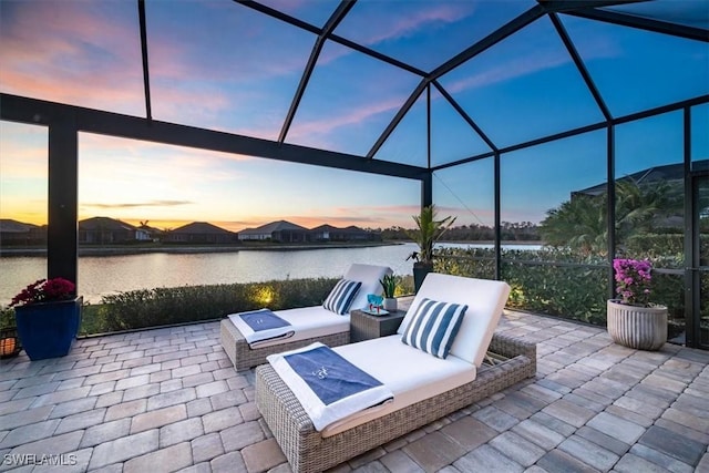 14372 Neptune Ave, Naples, FL 34114 - view of patio / terrace featuring a water view and glass enclosure