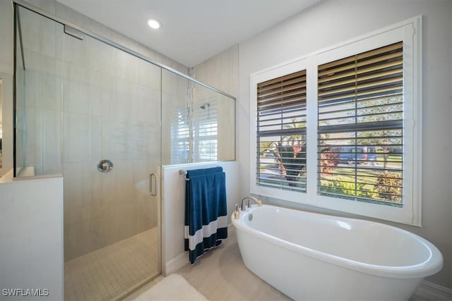 14372 Neptune Ave, Naples, FL 34114 - full bath featuring a freestanding bath, a stall shower, and recessed lighting