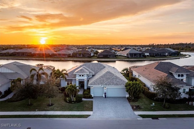 14372 Neptune Ave, Naples, FL 34114 - aerial view at dusk of a residential view and a water view