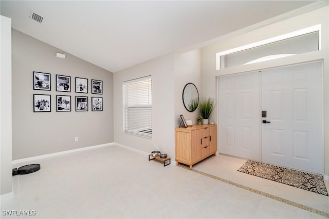 2310 SW 17th St, Cape Coral, FL 33991 - entryway with light tile patterned floors, lofted ceiling, and baseboards