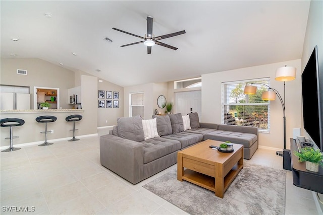 2310 SW 17th St, Cape Coral, FL 33991 - living area with lofted ceiling, ceiling fan, light tile patterned floors, and baseboards