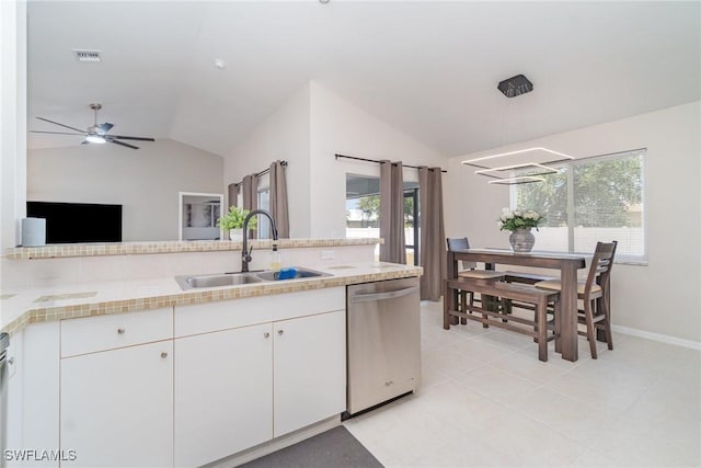 2310 SW 17th St, Cape Coral, FL 33991 - kitchen with dishwasher, a sink, vaulted ceiling, light countertops, and healthy amount of natural light