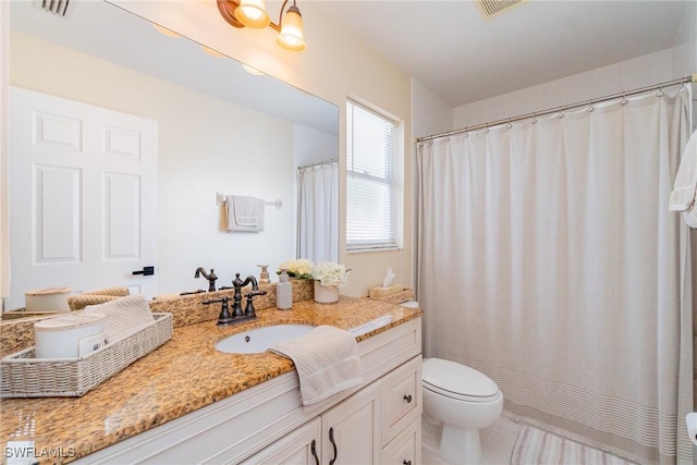 2310 SW 17th St, Cape Coral, FL 33991 - bathroom featuring toilet, vanity, and a shower with shower curtain