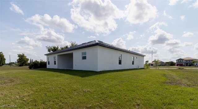 17211 Nile Ct, Punta Gorda, FL 33955 - view of property exterior featuring stucco siding and a lawn