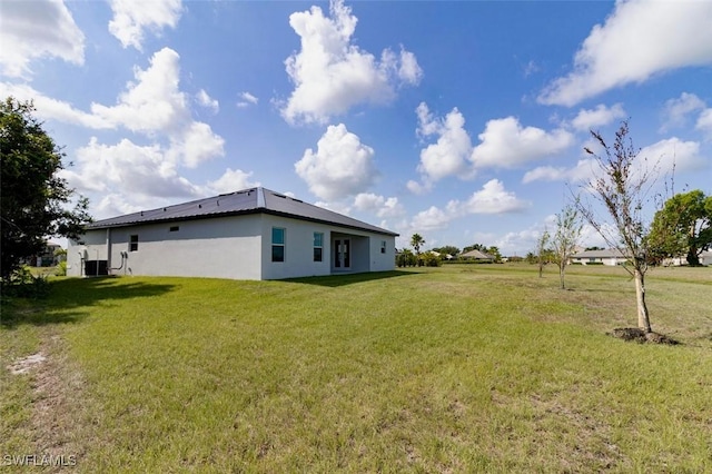 17211 Nile Ct, Punta Gorda, FL 33955 - view of grassy yard with central AC unit