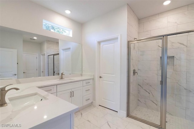 17211 Nile Ct, Punta Gorda, FL 33955 - bathroom with double vanity, a shower stall, marble look tiles, and recessed lighting