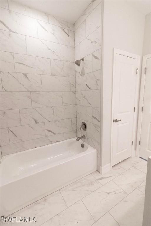 17211 Nile Ct, Punta Gorda, FL 33955 - full bathroom with marble look tile flooring, shower / bath combination, and baseboards