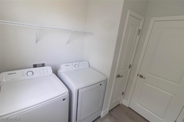 17211 Nile Ct, Punta Gorda, FL 33955 - laundry area featuring separate washer and dryer and light wood-style floors
