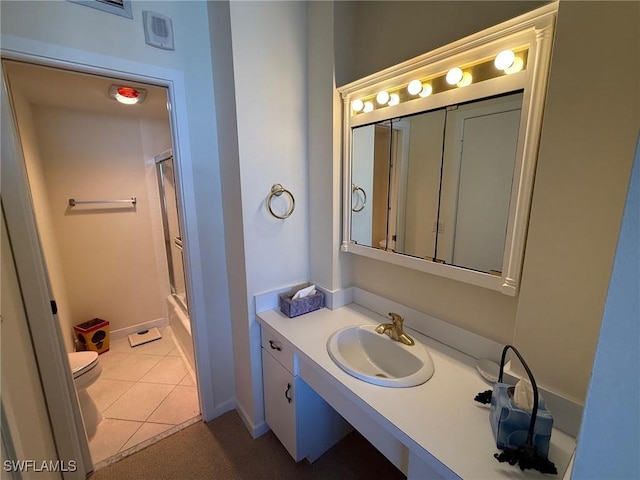 180 Seaview Ct Unit 715, Marco Island, FL 34145 - full bathroom with toilet, vanity, tile patterned floors, enclosed tub / shower combo, and baseboards
