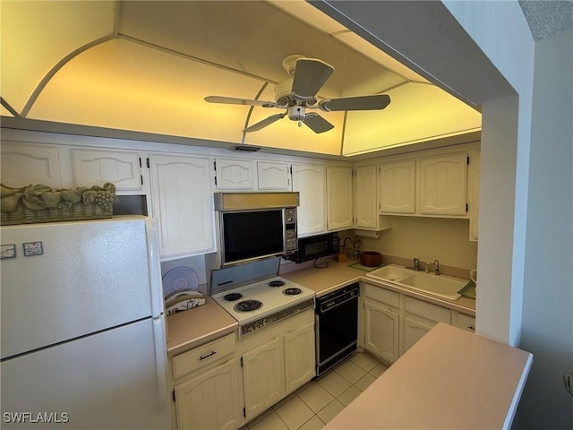 180 Seaview Ct Unit 715, Marco Island, FL 34145 - kitchen with black appliances, a sink, ceiling fan, light countertops, and white cabinetry
