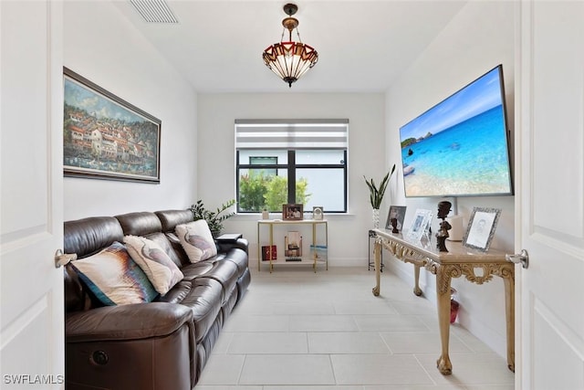 5596 Celebration Dr, Ave Maria, FL 34142 - living room with light tile patterned floors and baseboards