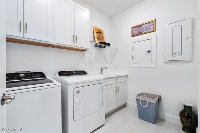 5596 Celebration Dr, Ave Maria, FL 34142 - laundry room with washer and dryer, cabinet space, baseboards, and electric panel