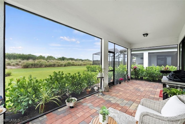 5596 Celebration Dr, Ave Maria, FL 34142 - sunroom featuring brick patterned floors