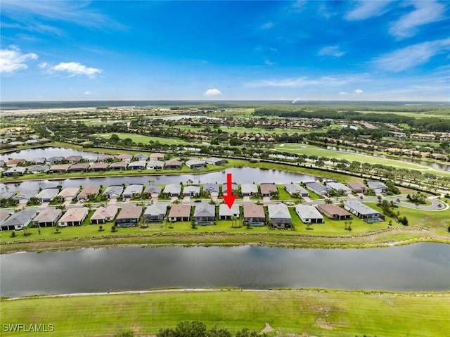 5596 Celebration Dr, Ave Maria, FL 34142 - aerial perspective of suburban area with a nearby body of water