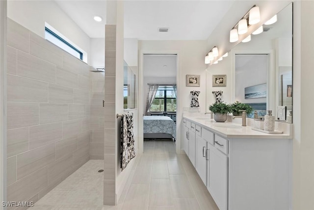 5596 Celebration Dr, Ave Maria, FL 34142 - full bathroom with vanity, a walk in shower, connected bathroom, and healthy amount of natural light