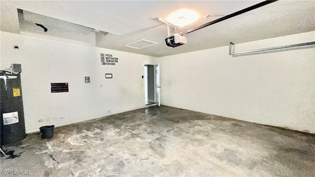 4532/4534 29th St SW, Lehigh Acres, FL 33973 - garage featuring a garage door opener and water heater